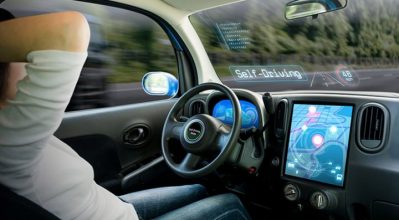 image of driver relaxing in the cockpit of a driverless car