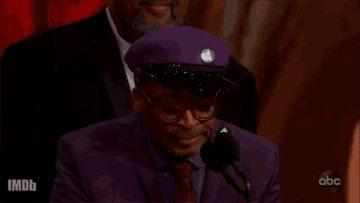 Spike Lee making his Oscar acceptance speech in 2019, captions reads ‘Let’s do the right thing’.