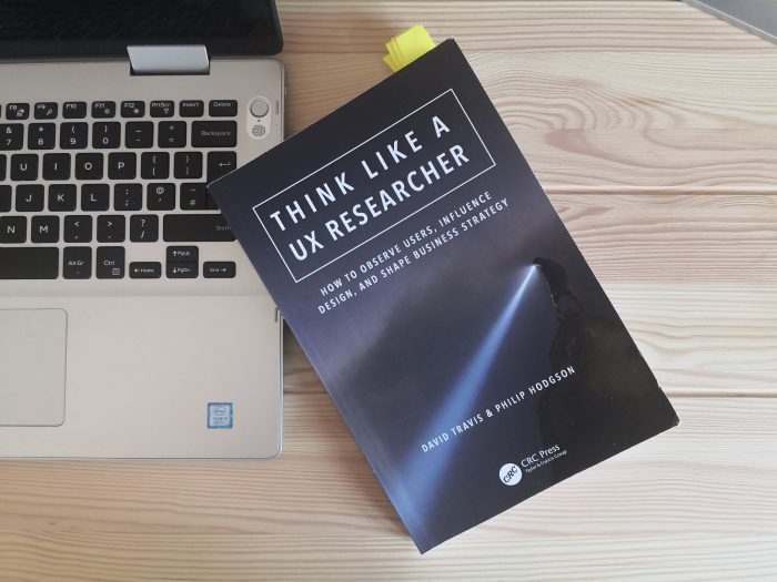 The book ‘Think Like a UX Researcher’ on a desk