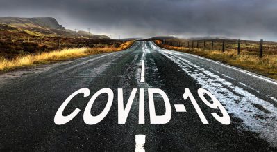 (alt="long road with the words COVID-19")